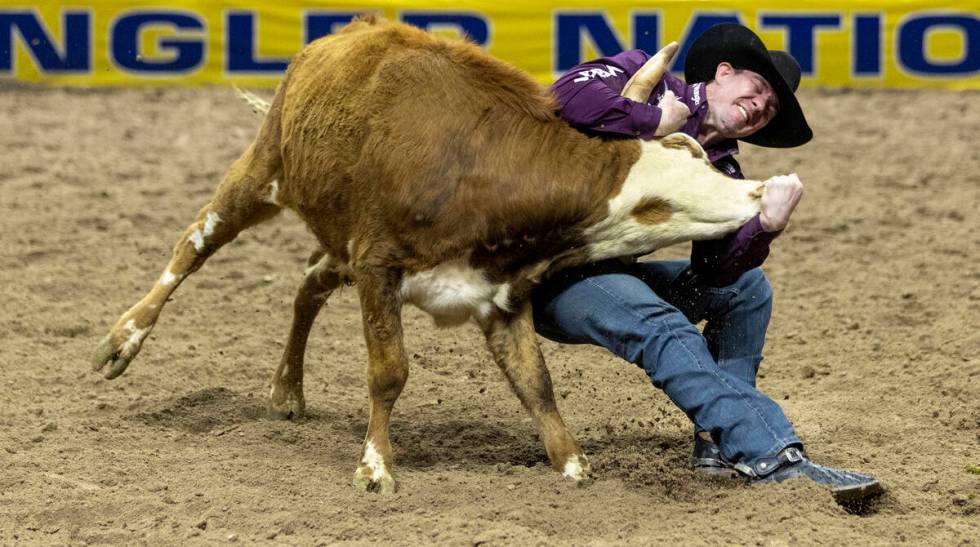 Dalton Massey competes in the steer wrestling event during day nine of the National Finals Rode ...