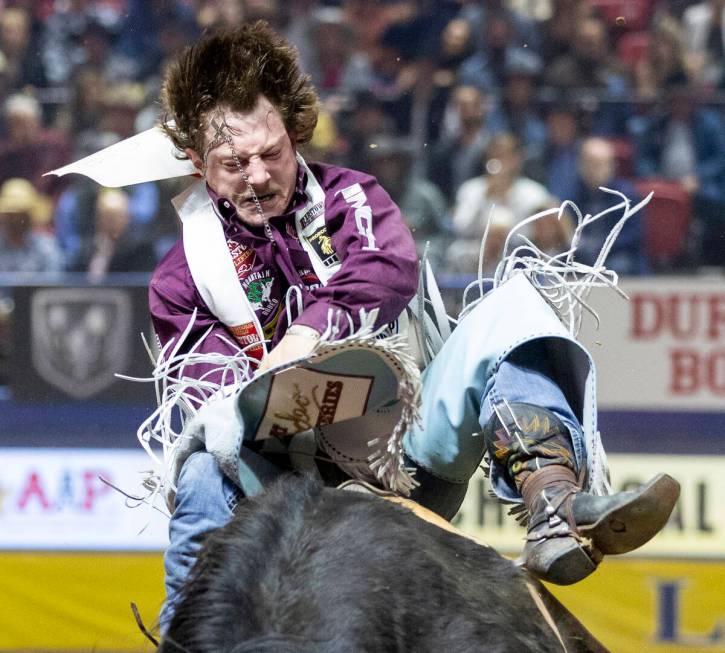 Keenan Hayes competes in the bareback riding event during day nine of the National Finals Rodeo ...