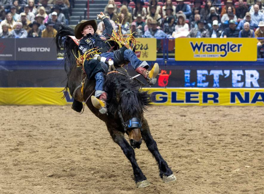 Jacob Lees competes in the bareback riding event during day nine of the National Finals Rodeo a ...