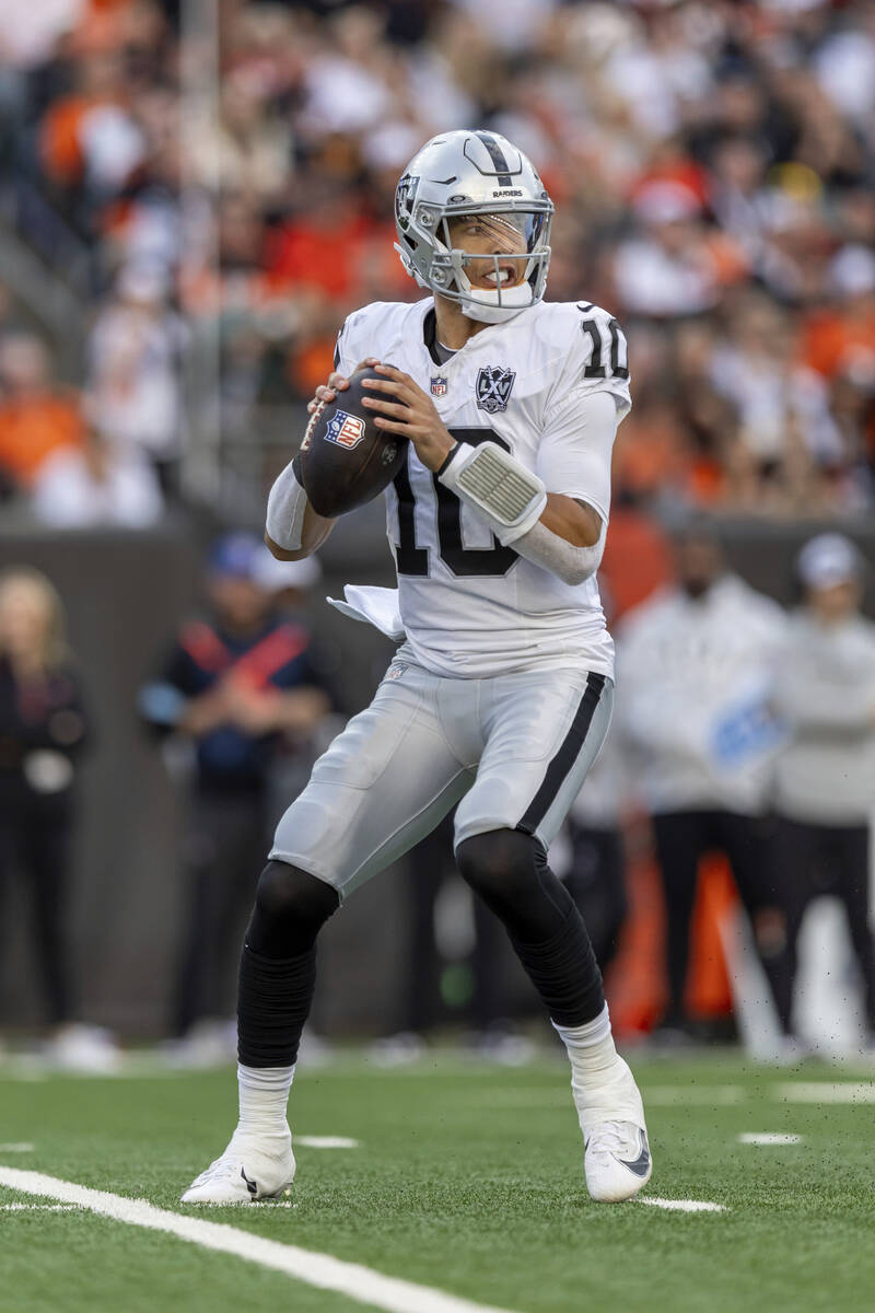 Las Vegas Raiders quarterback Desmond Ridder (10) drops back to pass against the Cincinnati Ben ...