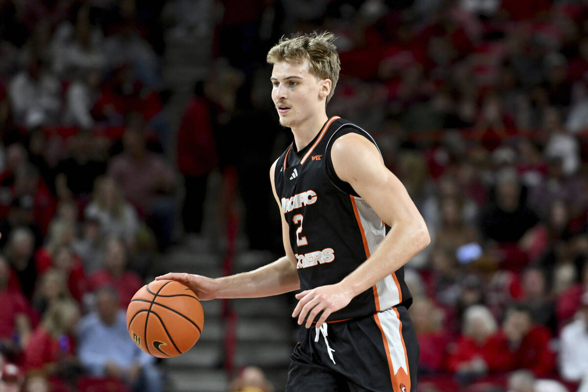 Pacific forward Elias Ralph (2) runs a play against Arkansas during an NCAA college basketball ...