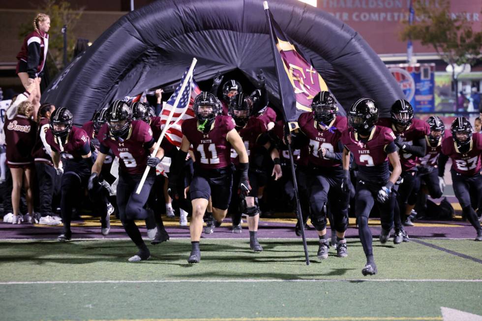 Faith Lutheran runs onto the field to take on Shadow Ridge in their NIAA Class 5A Division II S ...