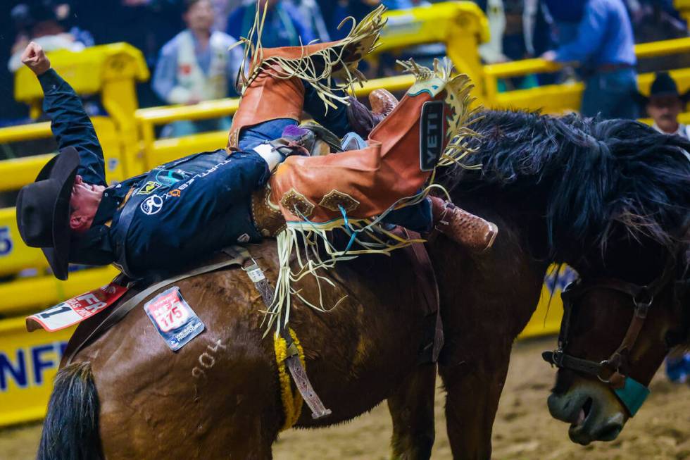 Bareback rider Richmond Champion takes his ride during the final night of National Finals Rodeo ...