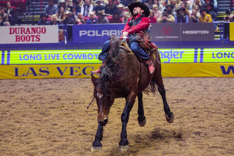 Bareback rider Garrett Shadbolt tries to stay upright for his ride during the final night of Na ...