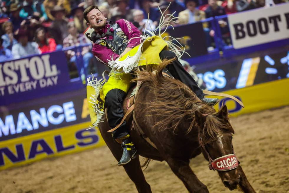 Bareback rider R.C. Landingham takes his ride during the final night of National Finals Rodeo a ...