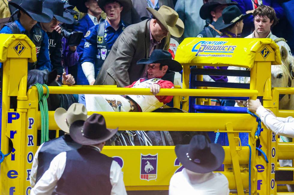 Bareback rider Cole Franks prepares to break out of the chute during the final night of Nationa ...