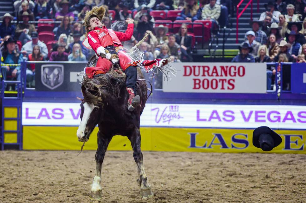 Bareback rider Rocker Steiner loses his hat while finishing his ride on OLS Tubs Stevie Knicks ...