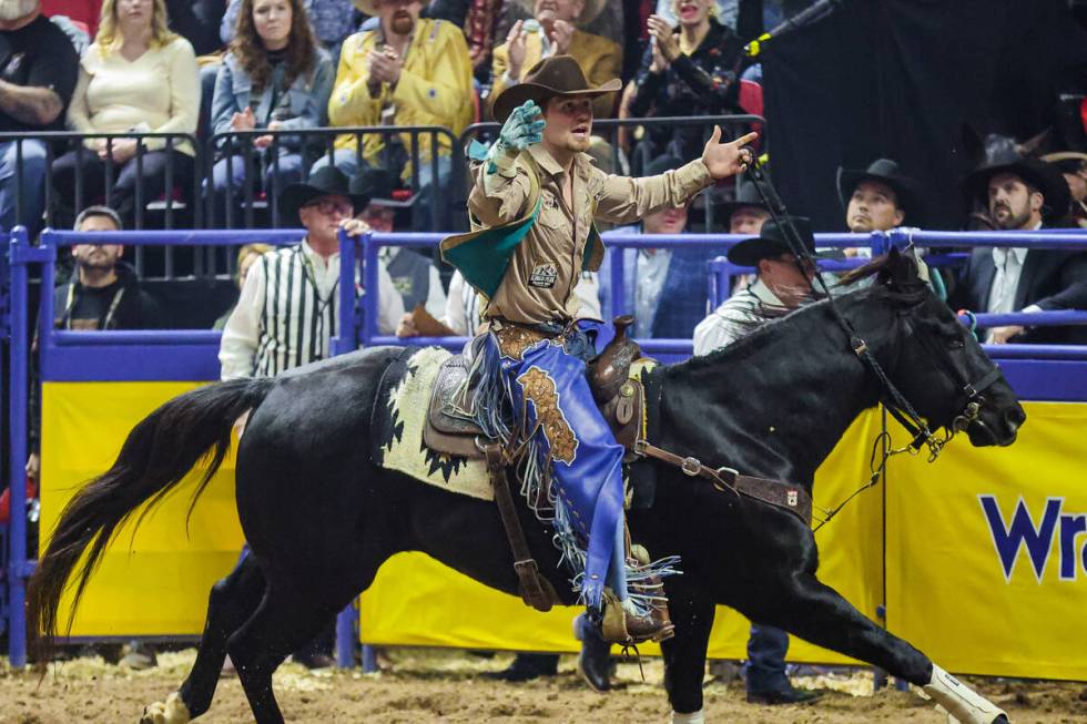 Bareback rider Dean Thompson rides out for a victory lap during the final night of National Fin ...