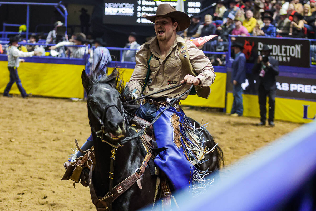 Bareback rider Dean Thompson rides out for a victory lap during the final night of National Fin ...