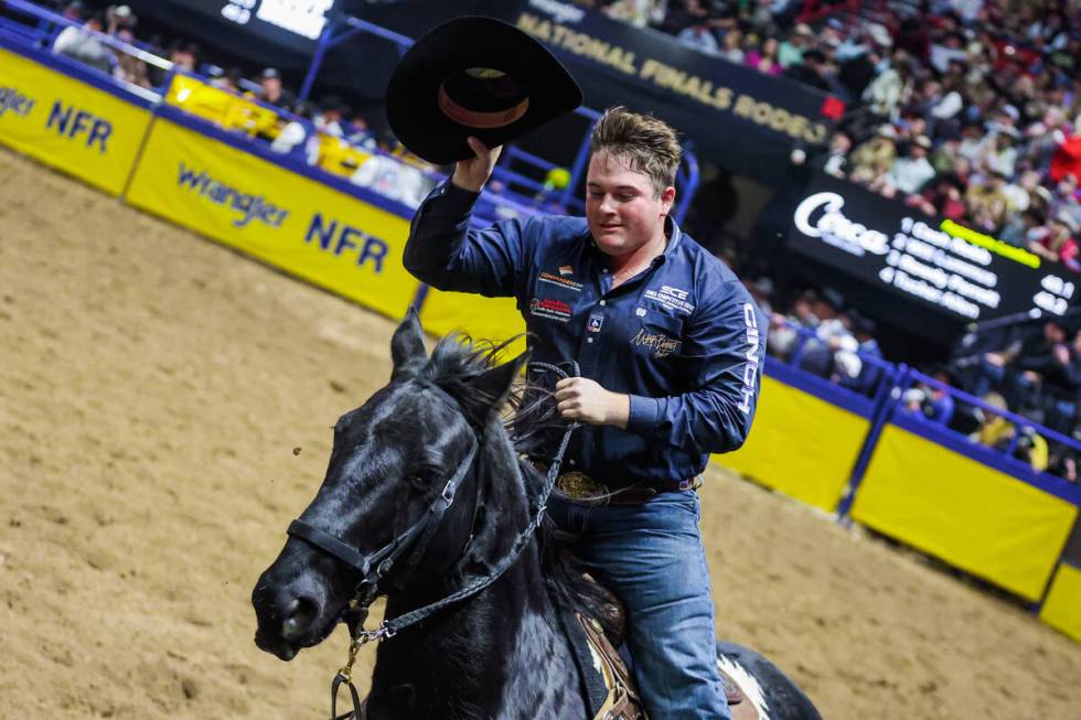 Steer wrestler Jesse Brown takes his victory lap for winning the round during the final night o ...