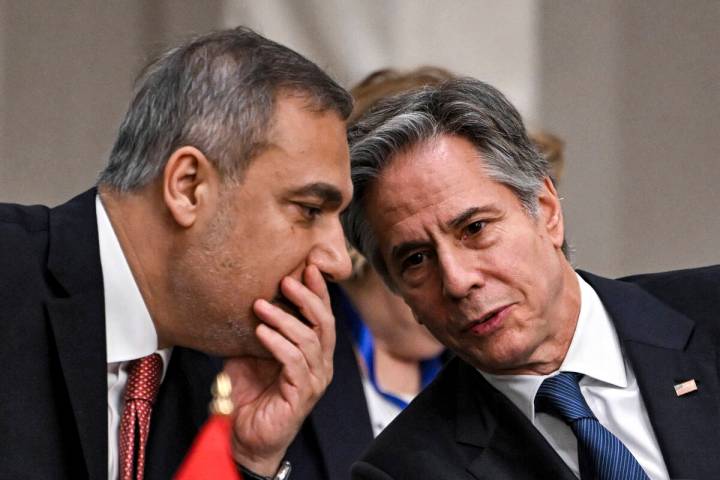 Turkey's Foreign Minister Hakan Fidan, left, speaks with US Secretary of State Antony Blinken d ...