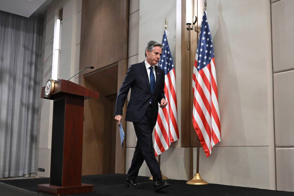 US Secretary of State Antony Blinken leaves after delivering a statement to the press after the ...