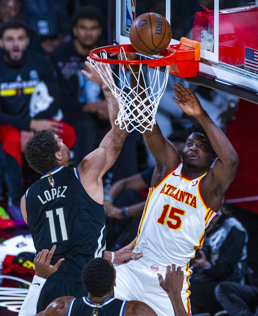 Milwaukee Bucks center Brook Lopez (11) is unable to stop a shot by Atlanta Hawks center Clint ...