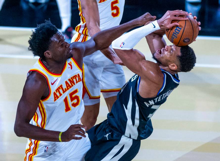 Atlanta Hawks center Clint Capela (15) fouls Milwaukee Bucks forward Giannis Antetokounmpo (34) ...