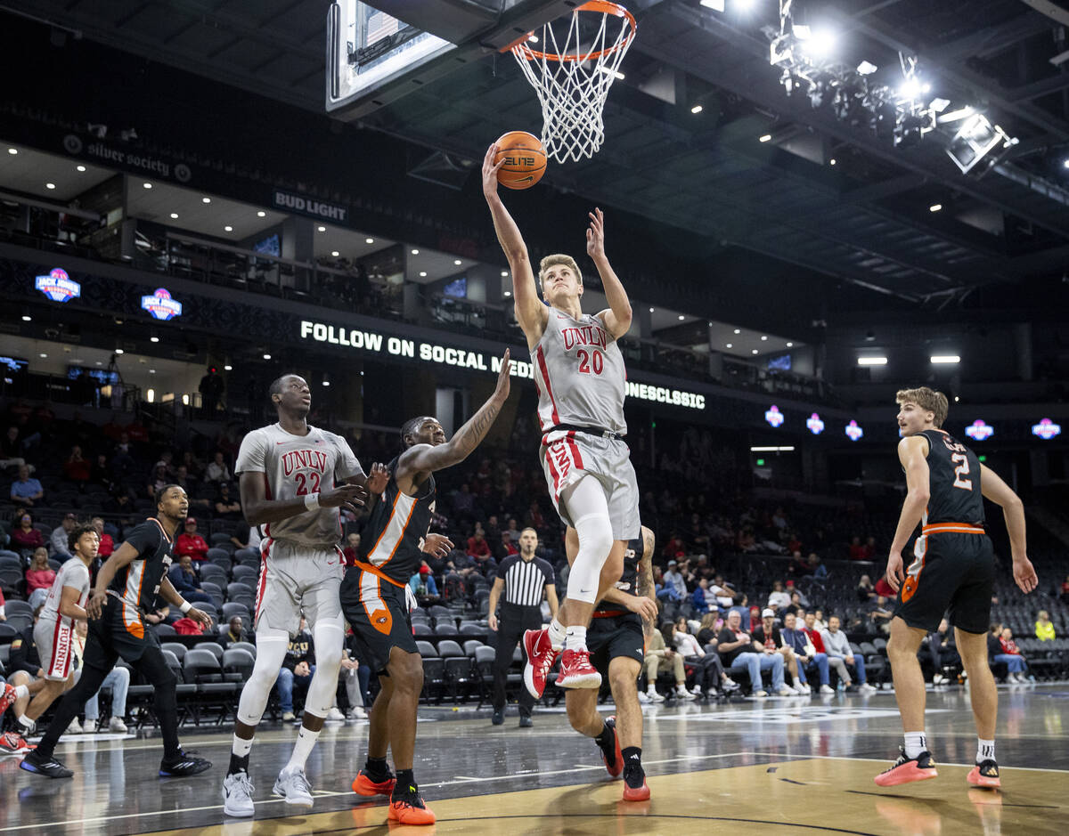 UNLV guard Julian Rishwain (20) attempts a layup during the Jack Jones Classic college basketba ...