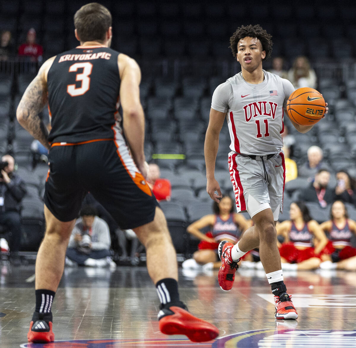 UNLV guard Dedan Thomas Jr. (11) controls the ball during the Jack Jones Classic college basket ...