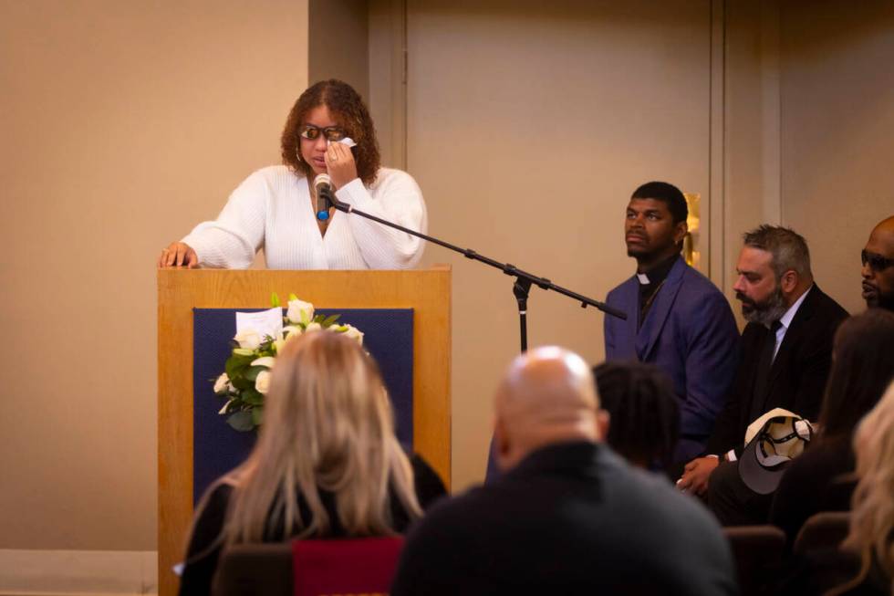 Isabella Durham talks about her late father, Brandon Durham, during the funeral service at Davi ...