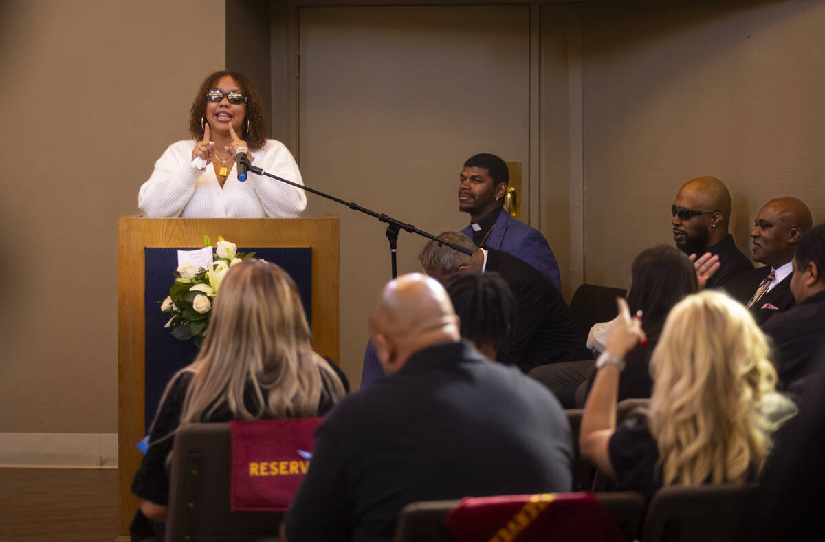 Isabella Durham talks about her late father, Brandon Durham, during the funeral service at Davi ...