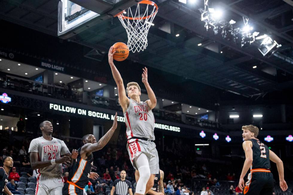 UNLV guard Julian Rishwain (20) attempts a layup during the Jack Jones Classic college basketba ...