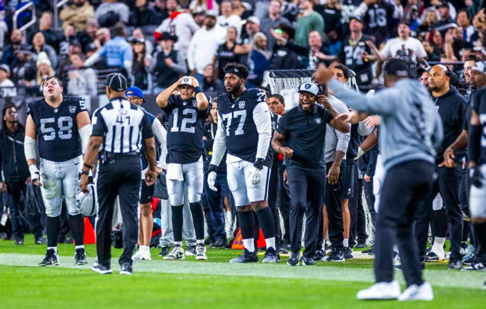 The Raiders sideline is visibly upset by a roughing the passer call against Raiders linebacker ...