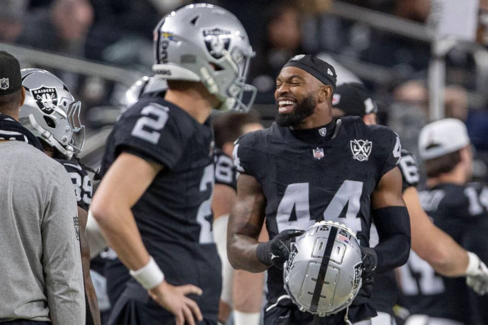 Raiders defensive end K'Lavon Chaisson (44) smiles on the sideline after a sack of Atlanta Falc ...