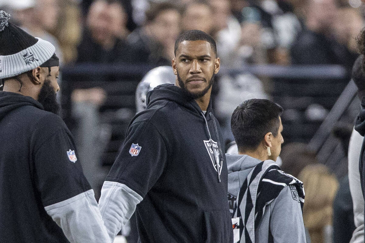 Raiders defensive end Charles Snowden on the sideline during the first half of an NFL game agai ...