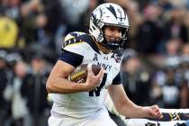 Navy quarterback Blake Horvath (11) runs with the ball during the first half of an NCAA college ...