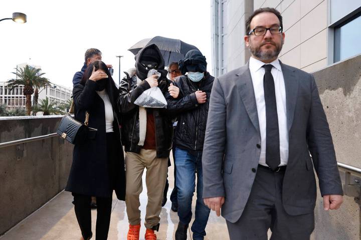 Alexander Smirnov, second left, leaves the Lloyd George U.S. Courthouse with his attorneys, Dav ...