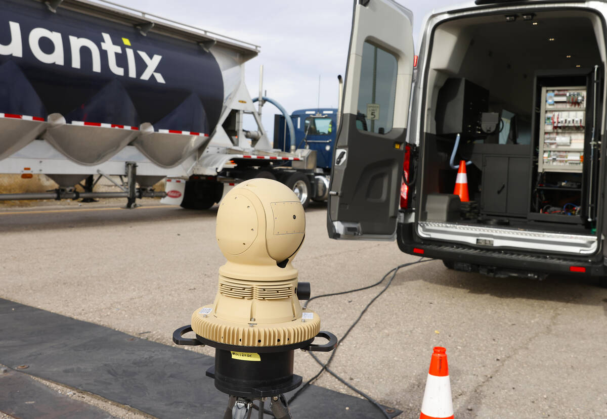 A truck drives past a thermal imaging camera at the Sloan Truck Weigh Station during a demonstr ...