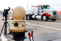 A truck drives past a thermal imaging camera at the Sloan Truck Weigh Station during a demonstr ...