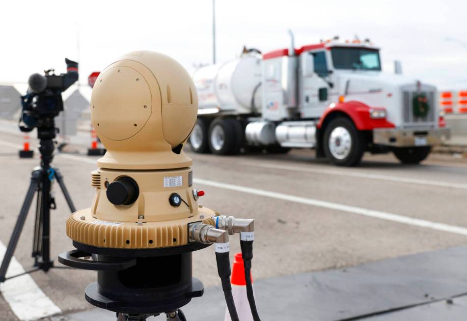 A truck drives past a thermal imaging camera at the Sloan Truck Weigh Station during a demonstr ...