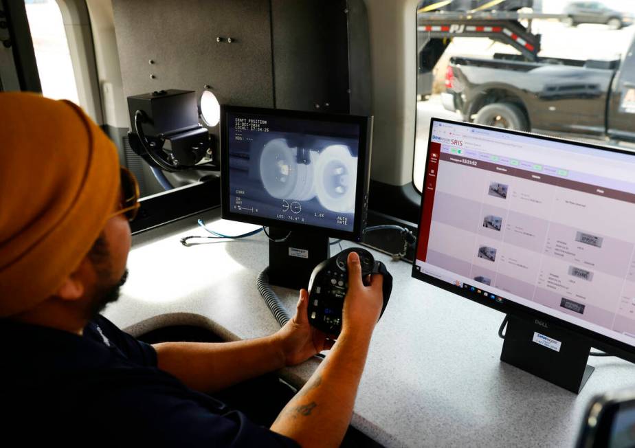 Ralph Camacho, a production technician at Drivewyze, demonstrates how a thermal imaging camera ...