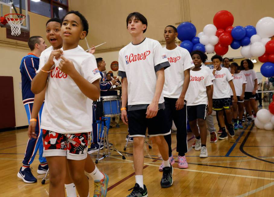 Children arrive at Bill and Lillie Heinrich YMCA to attend a ribbon cutting ceremony for Kim Re ...