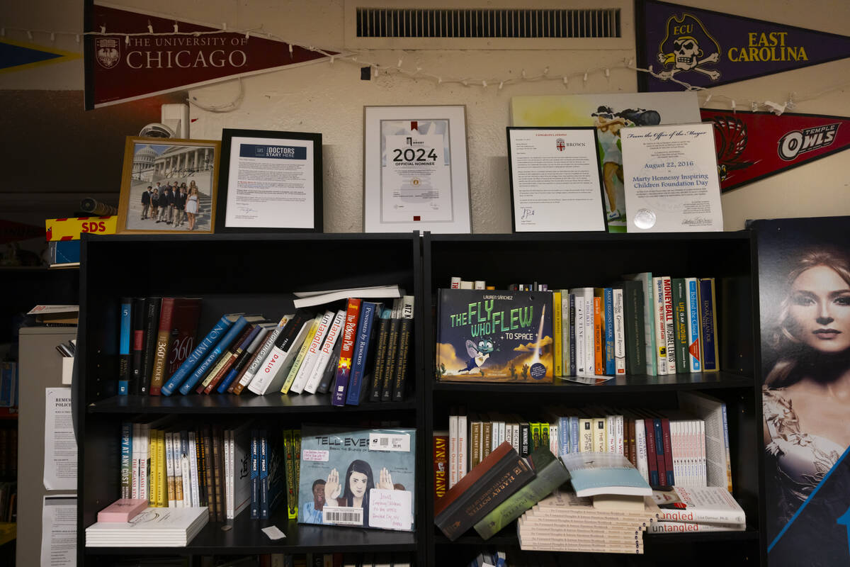 A library area with college pennants from former clients of the Inspiring Children Foundation, ...