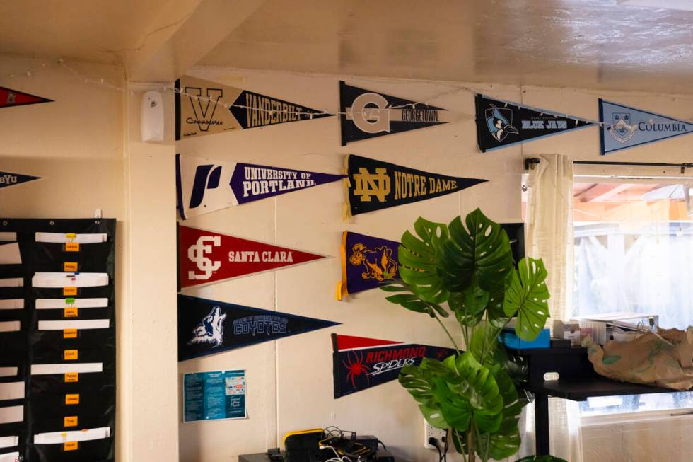 College pennants from former clients of the Inspiring Children Foundation, which assists youth ...