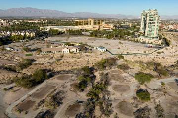 An aerial view of the shuttered Badlands Golf Course and the Queensridge towers, right, on Tues ...