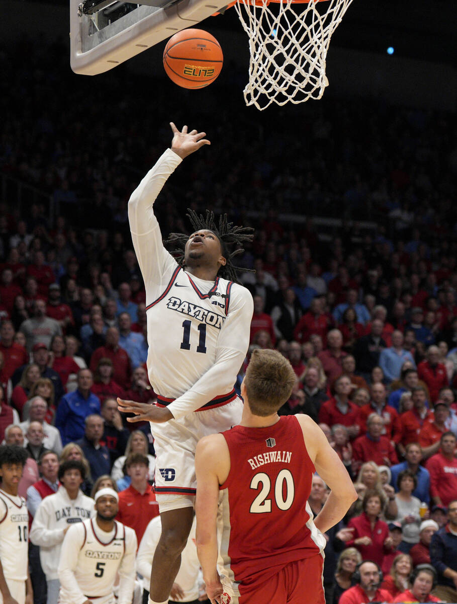 Dayton guard Malachi Smith (11) shoots against UNLV guard Julian Rishwain (20) during the secon ...