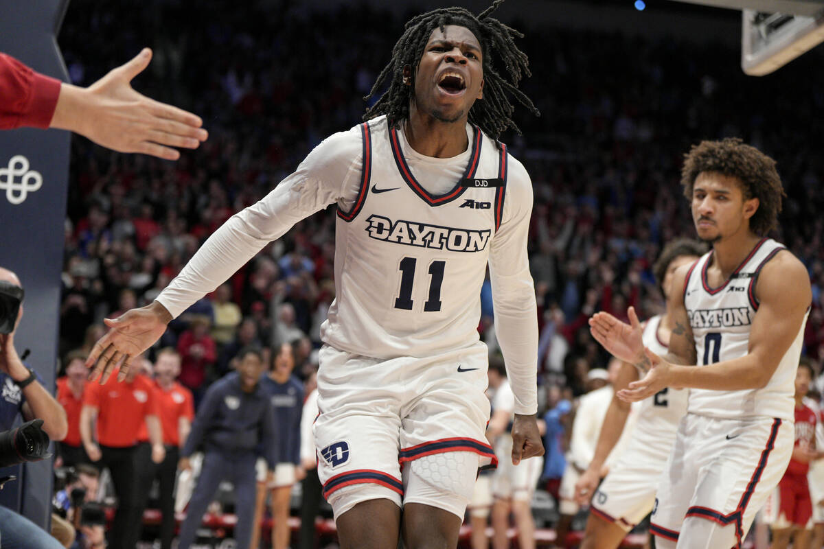 Dayton's Malachi Smith (11) reacts after scoring during the second half of an NCAA college bask ...