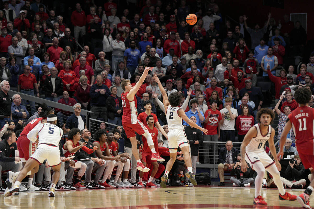 UNLV guard Julian Rishwain (20) shoots against Dayton forward Nate Santos (2) during the second ...