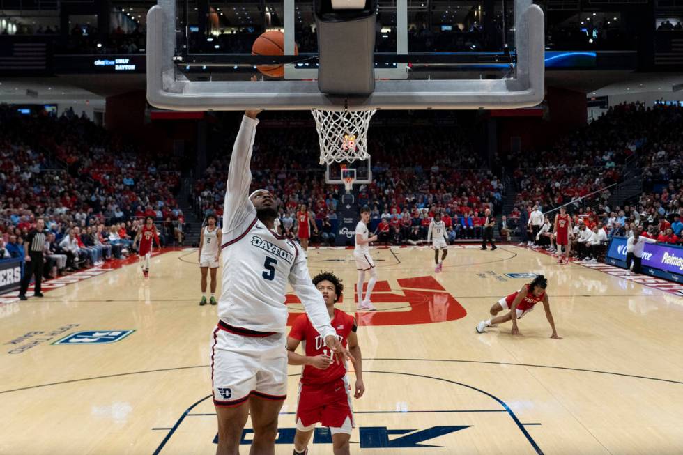 Dayton guard Posh Alexander (5) shoots against UNLV guard Dedan Thomas Jr. (11) during the firs ...