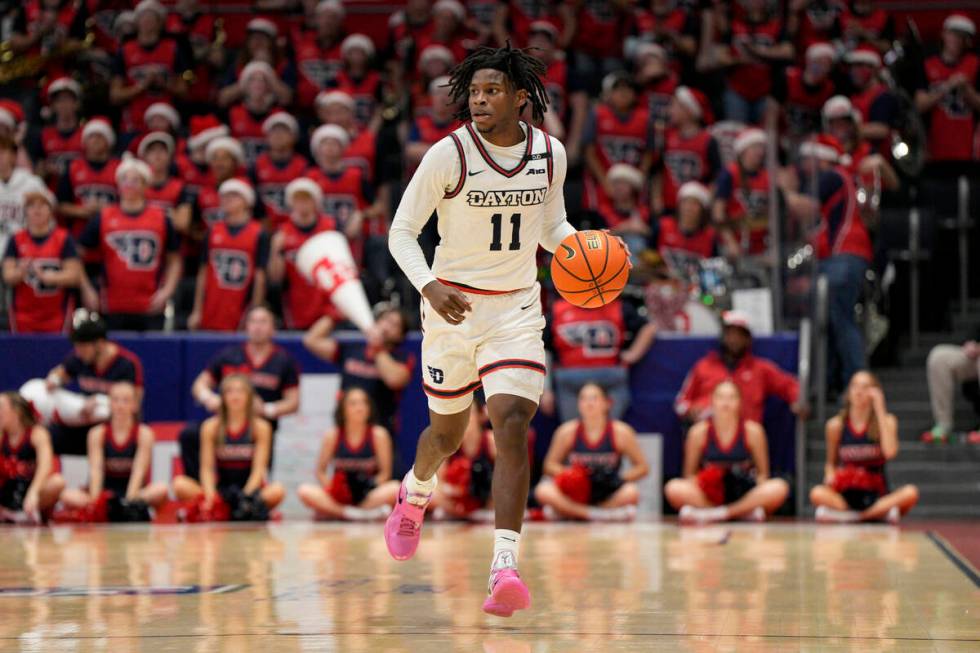 Dayton guard Malachi Smith (11) dribbles during the second half of an NCAA college basketball g ...