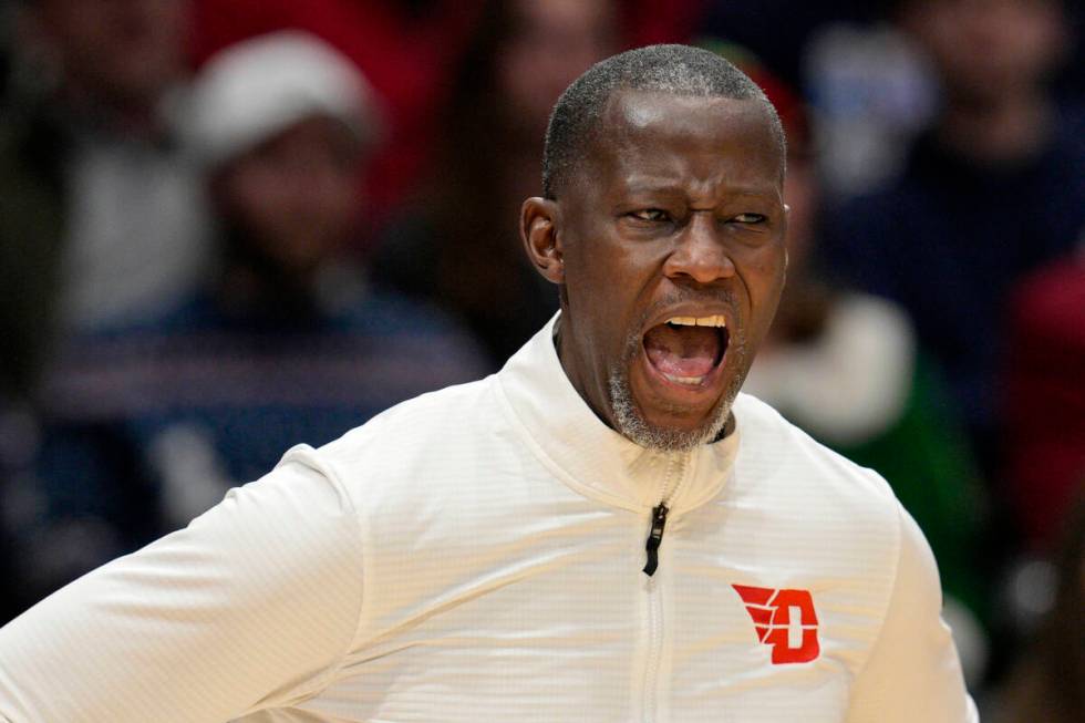 Dayton coach Anthony Grant shouts during the first half of an NCAA college basketball game agai ...