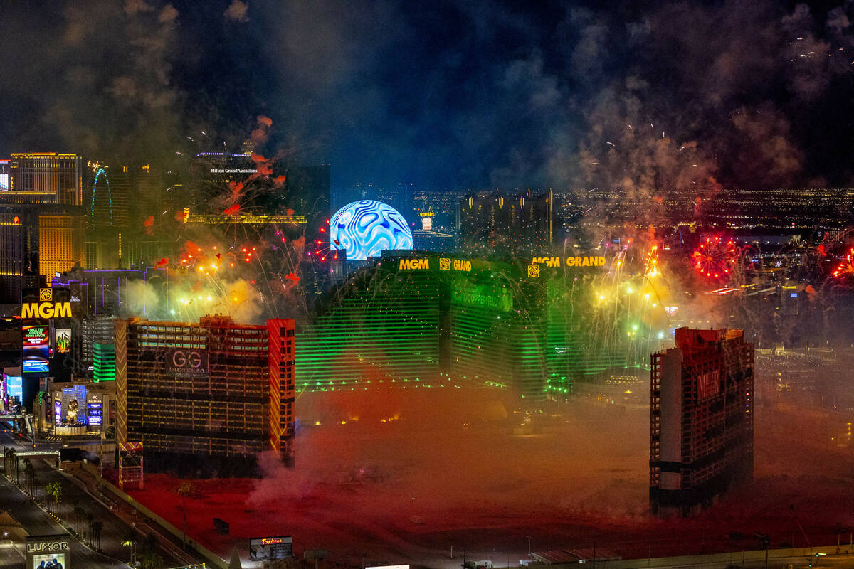 A fireworks and drone show precedes the Tropicana being imploded early in the morning while vie ...