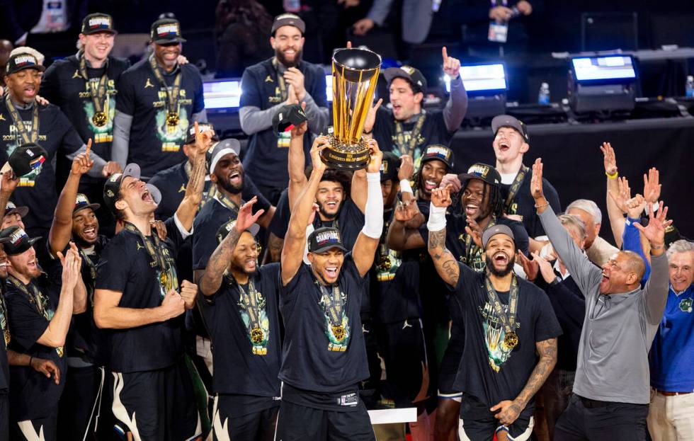 Milwaukee Bucks forward Giannis Antetokounmpo hoists the NBA Cup trophy after winning the NBA C ...