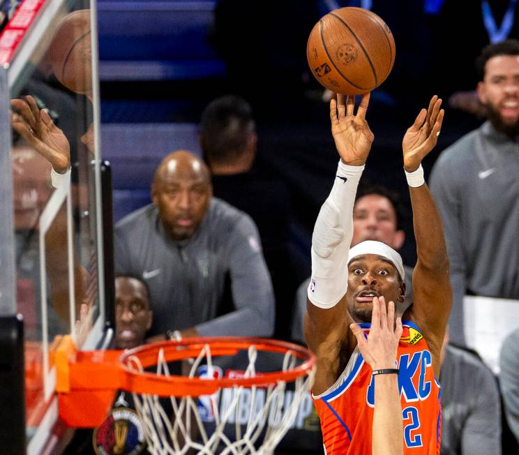 Oklahoma City Thunder guard Shai Gilgeous-Alexander (2) attempts a three-point shot during the ...