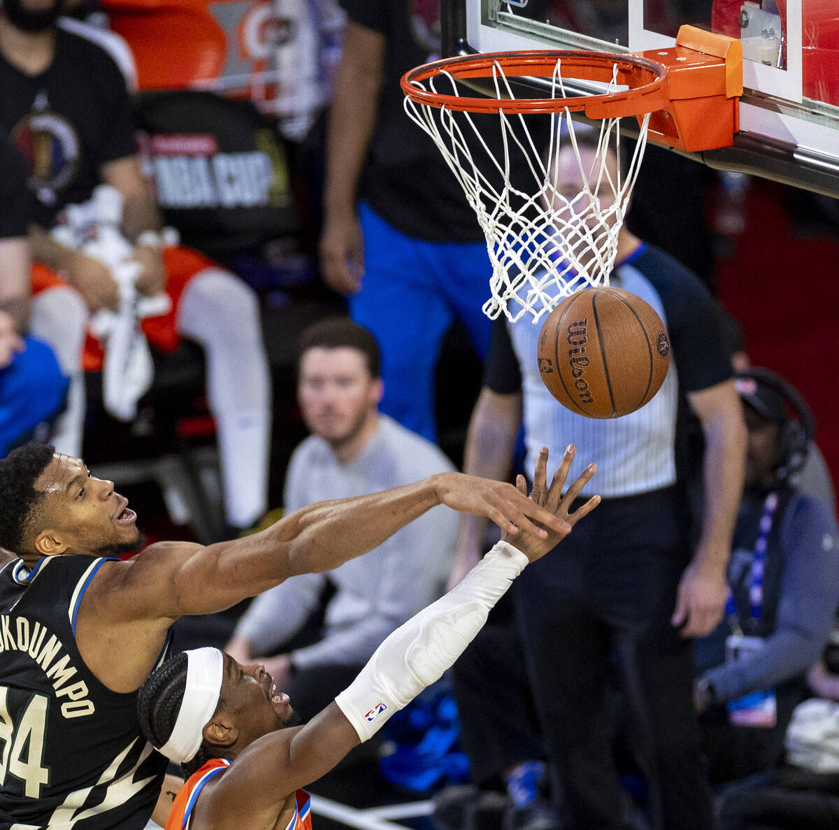 Milwaukee Bucks forward Giannis Antetokounmpo, left, blocks a shot by Oklahoma City Thunder gua ...