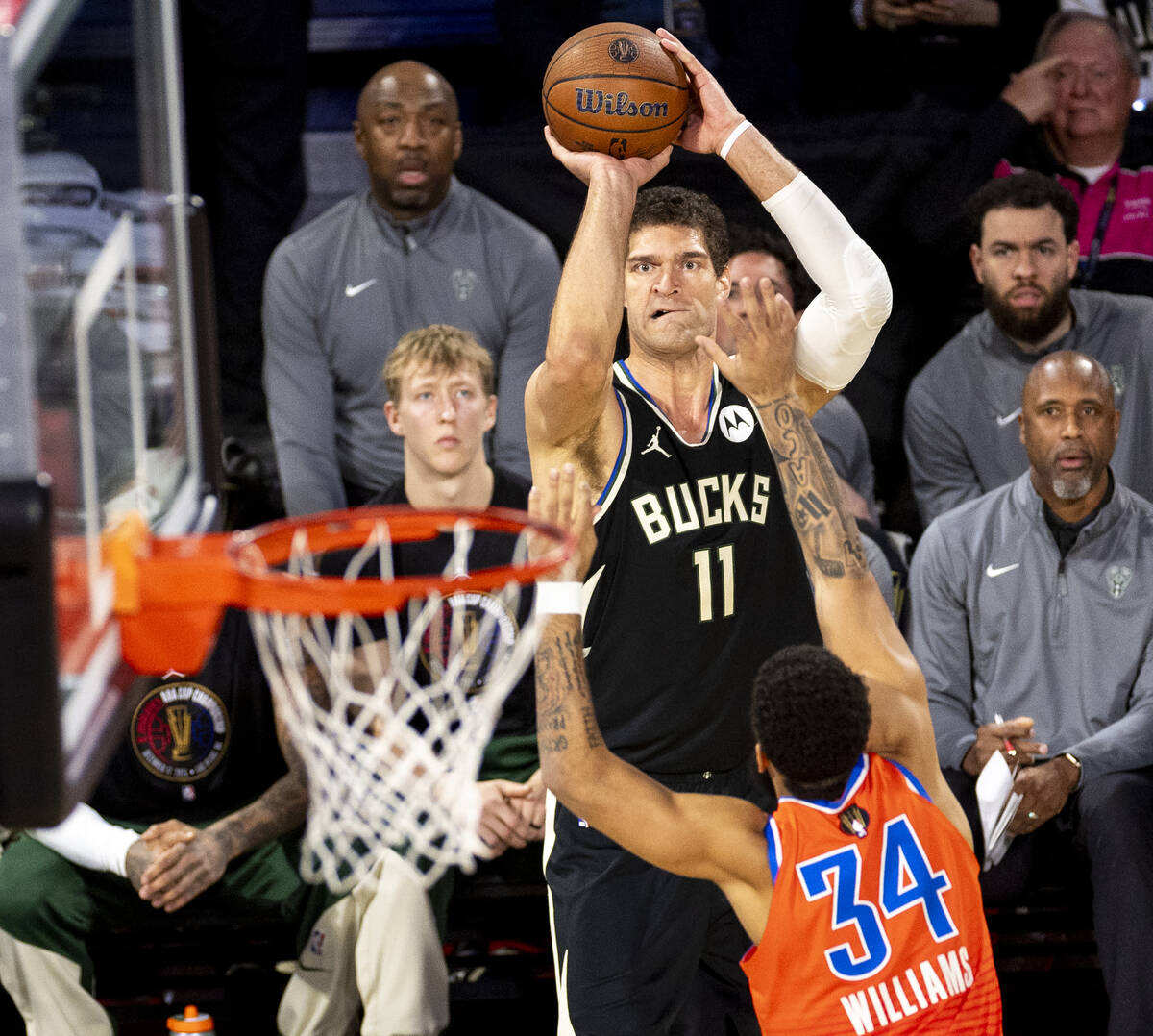 Milwaukee Bucks center Brook Lopez (11) attempts a three-point shot over Oklahoma City Thunder ...