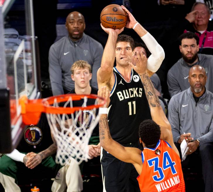 Milwaukee Bucks center Brook Lopez (11) attempts a three-point shot over Oklahoma City Thunder ...