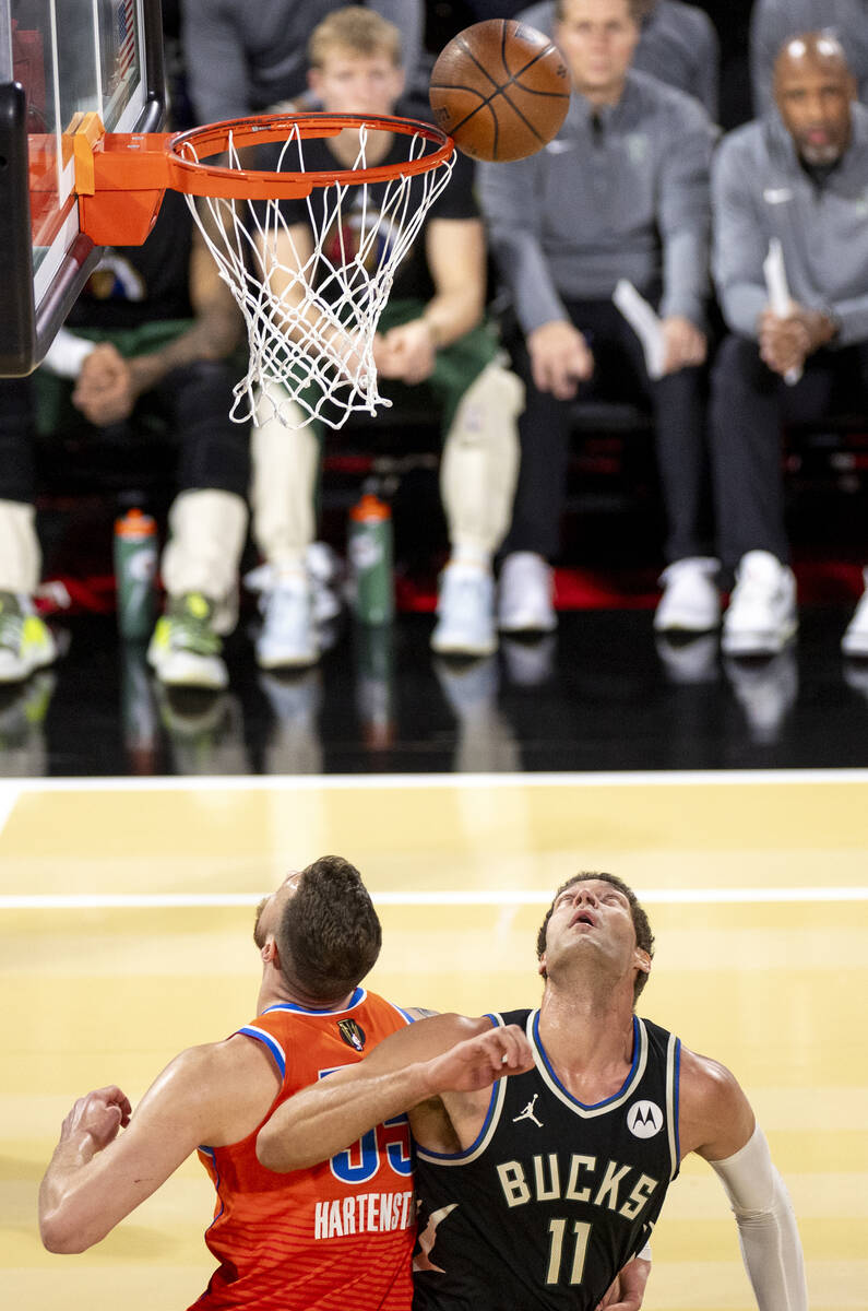 Milwaukee Bucks center Brook Lopez (11) and Oklahoma City Thunder center Isaiah Hartenstein, le ...