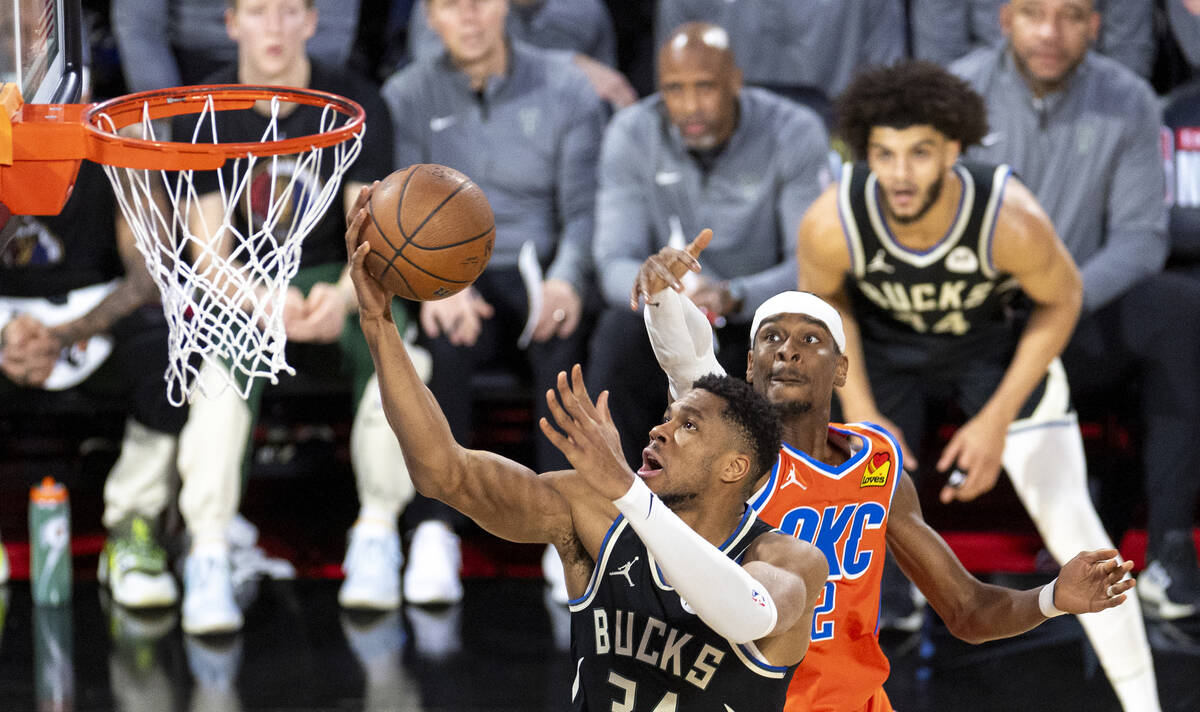 Milwaukee Bucks forward Giannis Antetokounmpo (34) attempts a layup past Oklahoma City Thunder ...